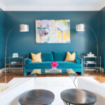 turquoise sofa against the wall