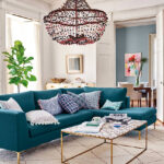 turquoise sofa with chandelier