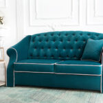 turquoise sofa with beige trim