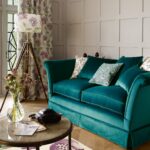 turquoise sofa with floor lamp