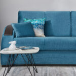 turquoise sofa with coffee table