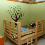 children's bed made of wood with a ladder