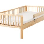 children's bed made of wood with long legs