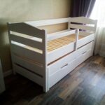 children's bed made of wood with wardrobes