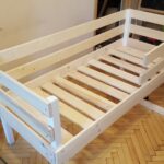 children's bed made of wood with slats