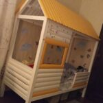 children's bed made of wood yellow house