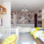 baby bed with yellow armchair