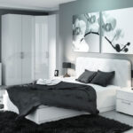 white furniture in the bedroom with dark linen