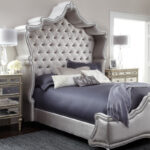 bed with a headboard with a canopy