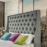 bed with headboard gray with pillows