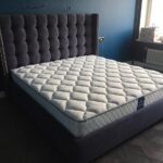 bed with headboard dark with mattress