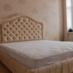 bed with headboard upholstered