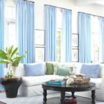 blue curtains on large long windows