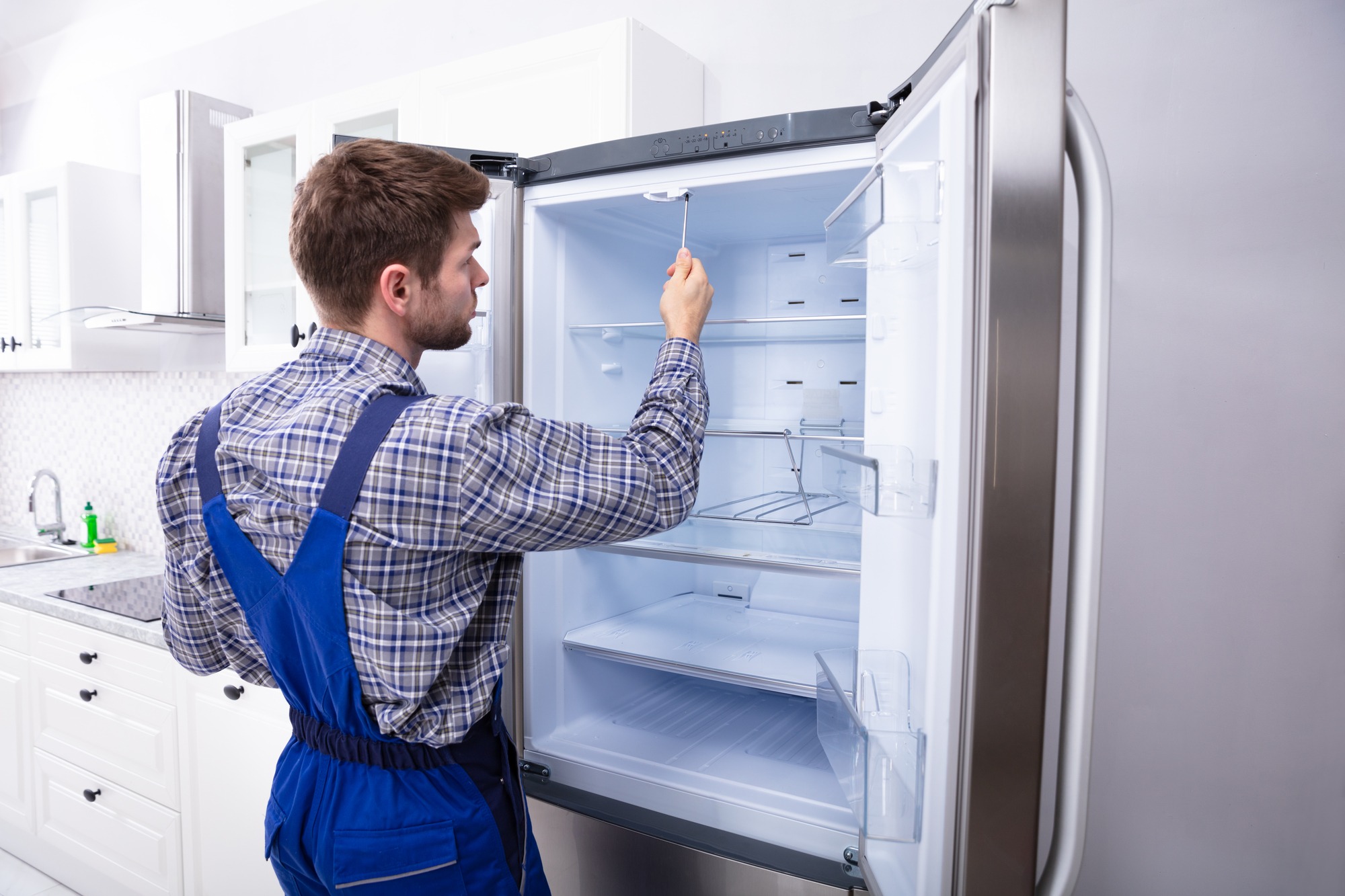 refrigerator leaks from above