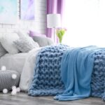 blue bedspread on the sofa