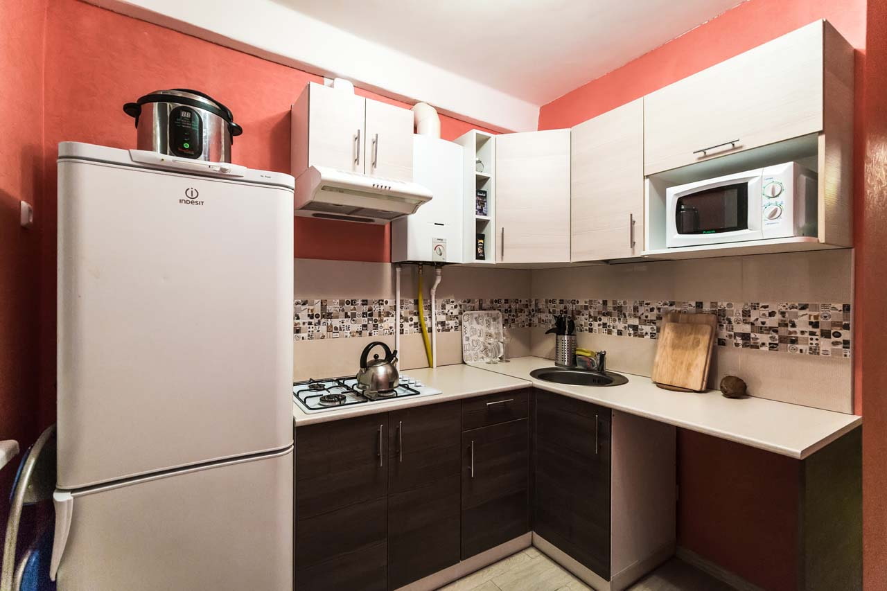 kitchen with gas boiler between cupboards