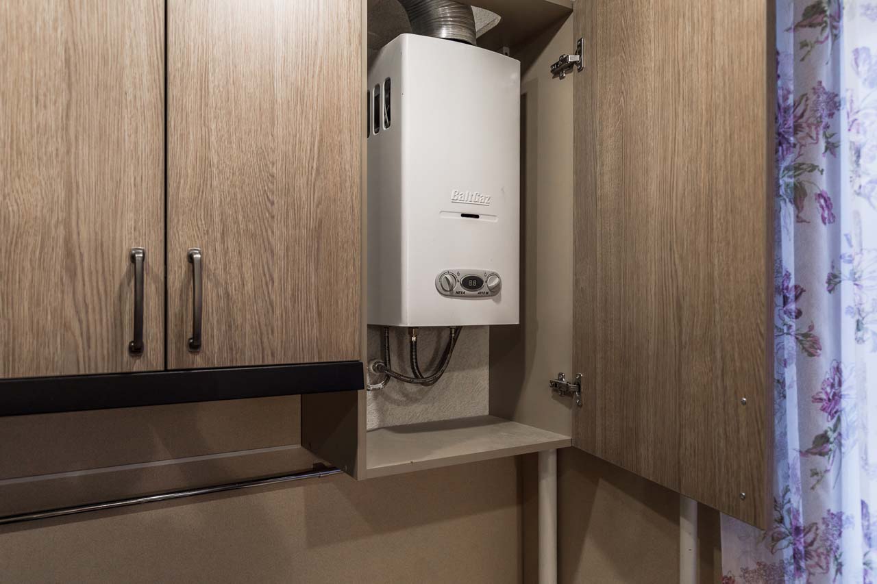 kitchen with gas boiler in the cupboard