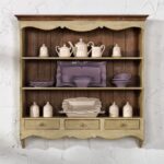 Provence shelf in the kitchen with violet dishes