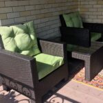 green rattan armchairs