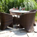 bent rattan armchairs