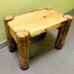 table made of wood with logs