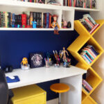 shelves above the table in the nursery