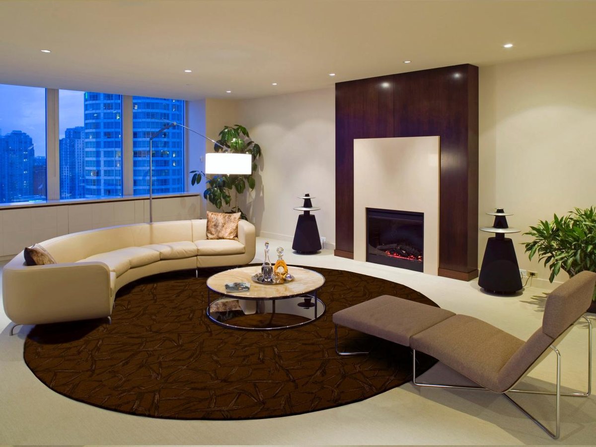 dining room with seating area in a round living room