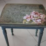 table with inscription and flower