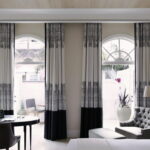 black and gray curtains on the windows