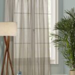 curtains-mesh with a floor lamp