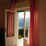 curtains in a room with a balcony door design photo