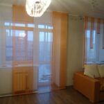 curtains in a room with a balcony door photo options