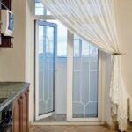 curtains in a room with a balcony door photo options