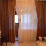 curtains in a room with a balcony door photo options