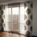 curtains in a room with a balcony door views