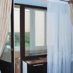 curtains in a room with a balcony door review