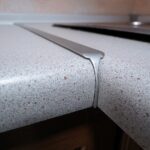 the joint of the countertop in the kitchen with the profile of the idea photo