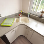 corner cabinet under the sink in the kitchen design photo