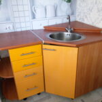 corner cabinet under the sink in the kitchen photo views