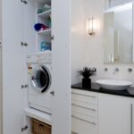 built-in wardrobe in the bathroom near the door