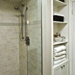 built-in wardrobe in the bathroom near the shower