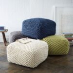 knitted pouf square with a book