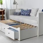 pull-out bed with blue pillow