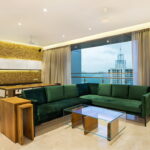 green sofa in the interior views