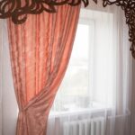 openwork lambrequin brown on pink curtains