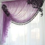 openwork lambrequin on a purple curtain