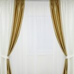 white curtains with gold