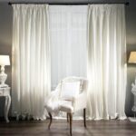 white curtains with armchair