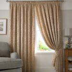 beige curtains with armchair