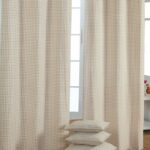 beige curtains with pillows